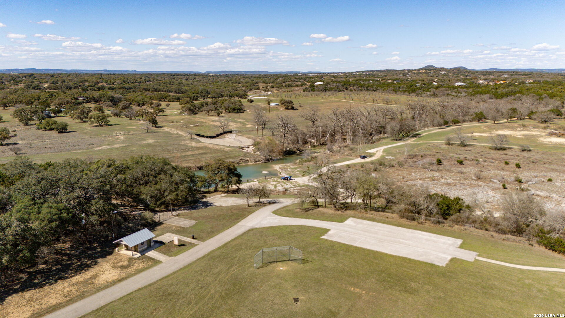 344 Buckskin Trail Bandera, TX 78003 - Photo 44 of 50 a view of a lake with a mountain