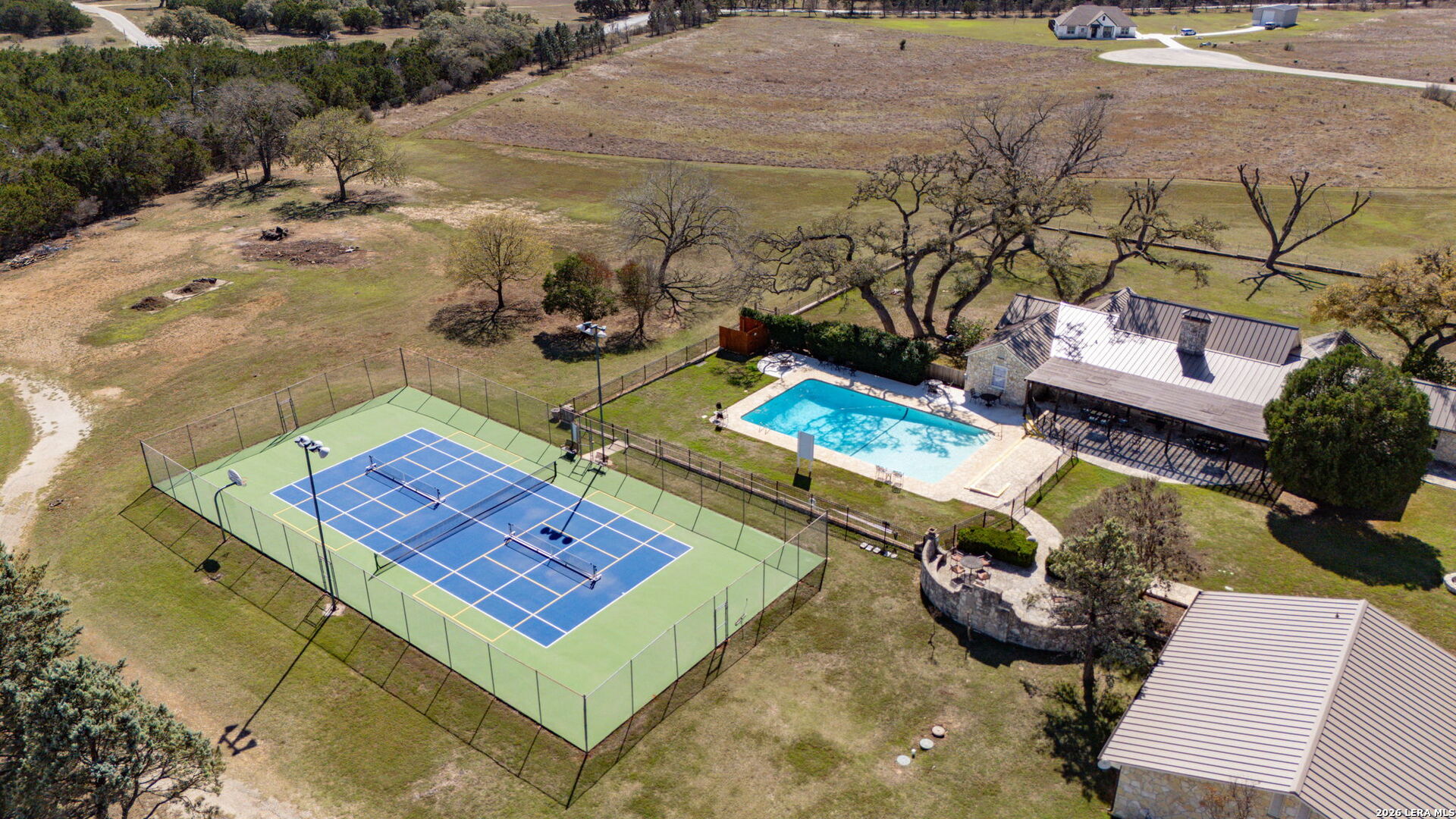 344 Buckskin Trail Bandera, TX 78003 - Photo 46 of 50 a view of a backyard with chairs