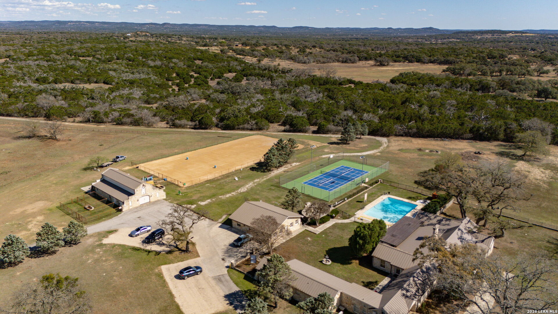 344 Buckskin Trail Bandera, TX 78003 - Photo 48 of 50 an aerial view of residential houses with outdoor space