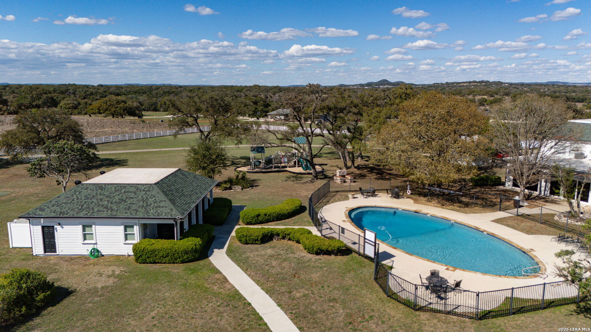 344 Buckskin Trail Bandera, TX 78003 - Photo 50 of 50 a view of a swimming pool with a yard