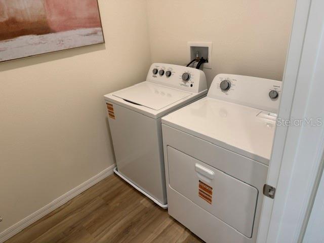 10507 Tucker Road Weeki Wachee, FL 34613 - Photo 33 of 39 a utility room with dryer and washer