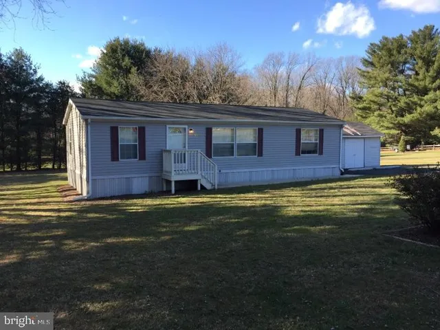 a brick house with a large yard