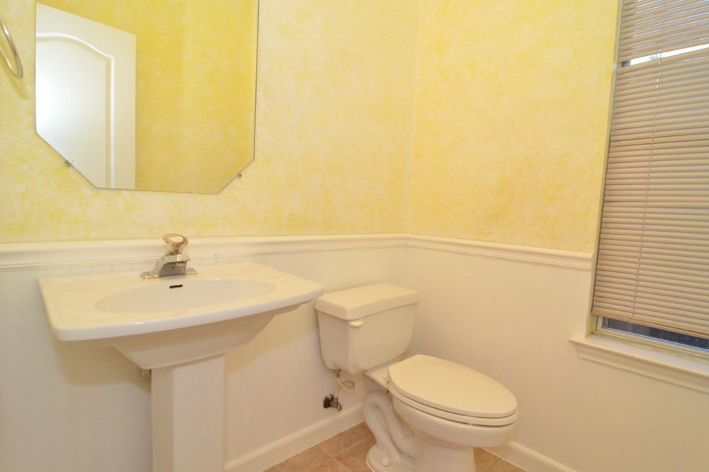 9405 Lightwood Loop Austin, TX 78748 - Photo 21 of 24 White pedestal sink with a single-handle faucet