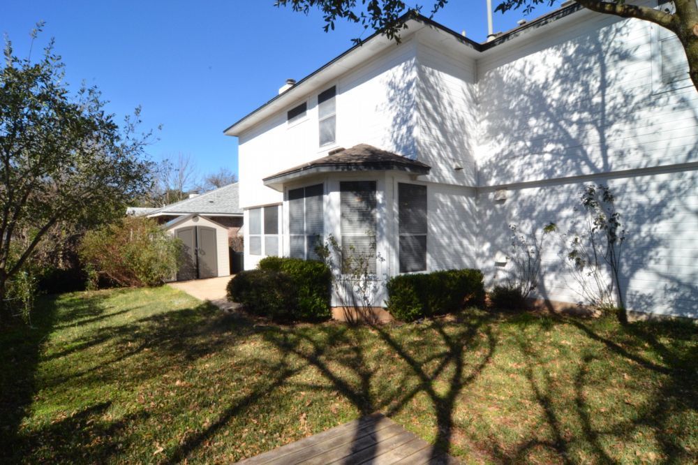9405 Lightwood Loop Austin, TX 78748 - Photo 6 of 24 White brick exterior with a bay window and dark trim