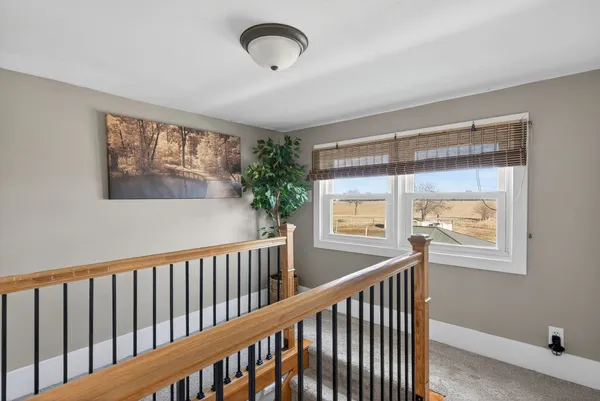 a view of a porch with wooden floor and windows