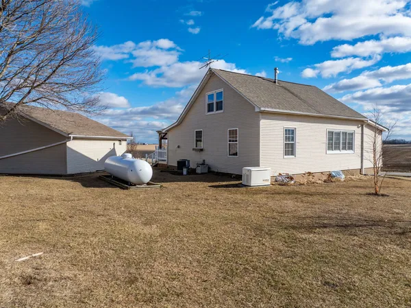 a view of a house with a backyard