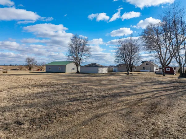 a view of a yard with a house