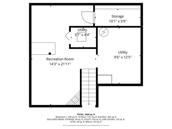 a view of a green field with house in the background
