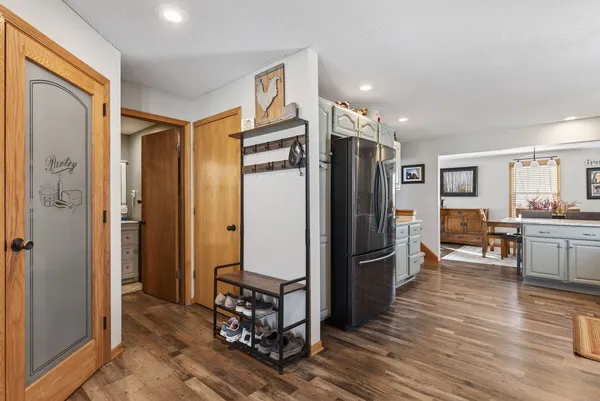 a kitchen with stainless steel appliances a refrigerator and cabinets