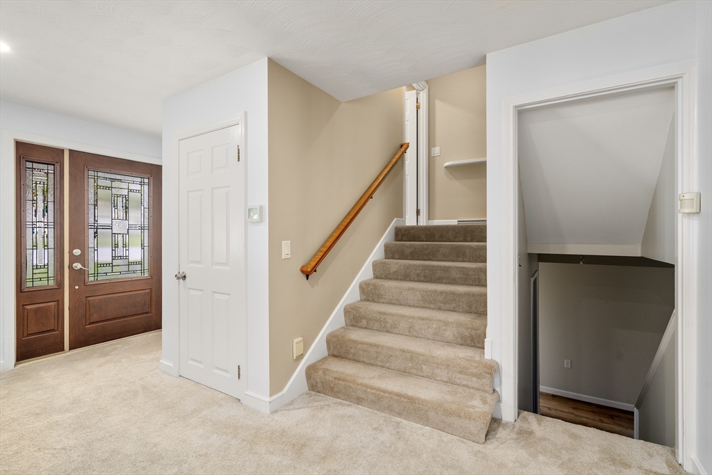 56 Paul Road Holliston, MA 01746 - Photo 11 of 33 a view of entryway and hall with wooden floor