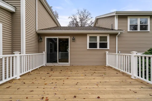 a view of a house with a door and wooden floor