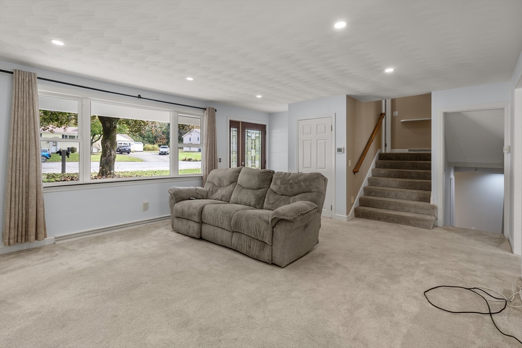 56 Paul Road Holliston, MA 01746 - Photo 10 of 33 a living room with furniture and a large window
