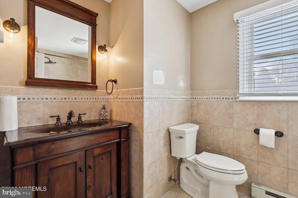 229 Point Pleasant Avenue Bayville, NJ 08721 - Photo 11 of 27 a bathroom with a granite countertop toilet sink and mirror