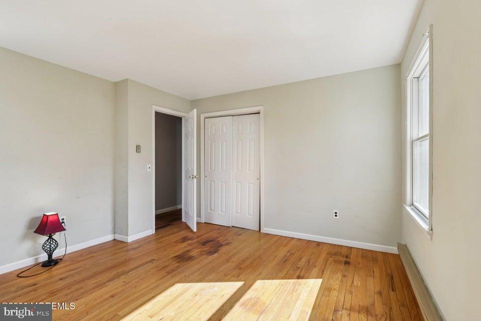 229 Point Pleasant Avenue Bayville, NJ 08721 - Photo 16 of 27 a bedroom with a bed and wooden floor