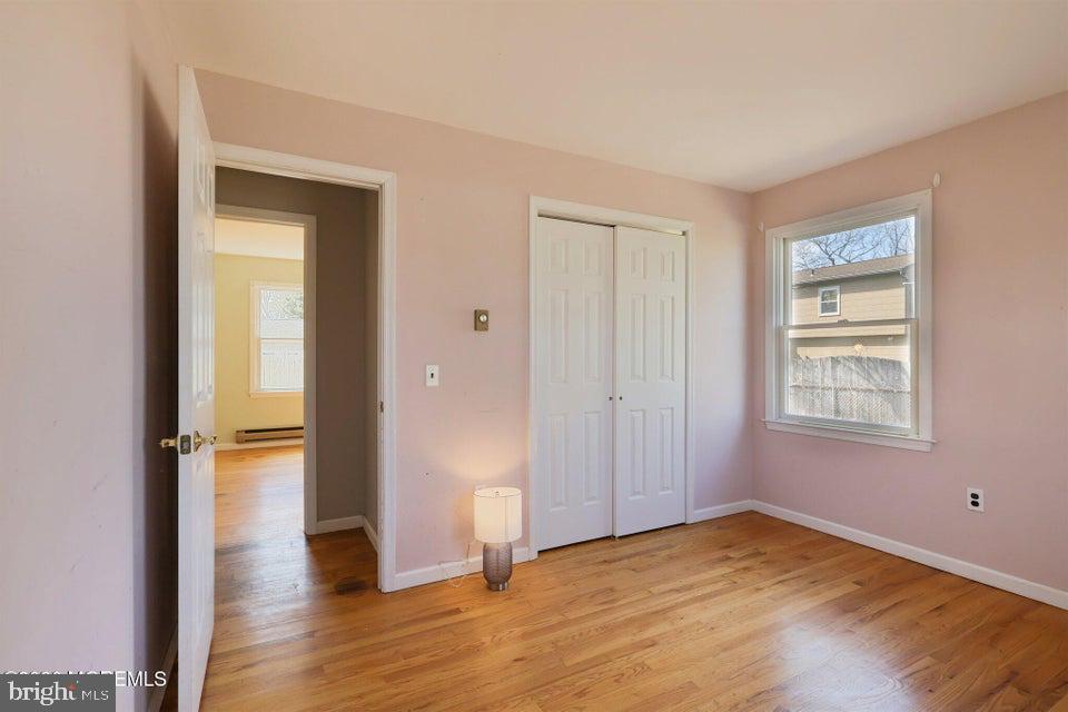 229 Point Pleasant Avenue Bayville, NJ 08721 - Photo 19 of 27 a view of empty room with wooden floor