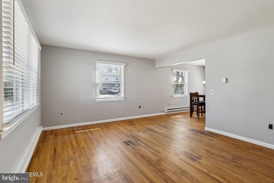 229 Point Pleasant Avenue Bayville, NJ 08721 - Photo 2 of 27 an empty room with wooden floor and windows