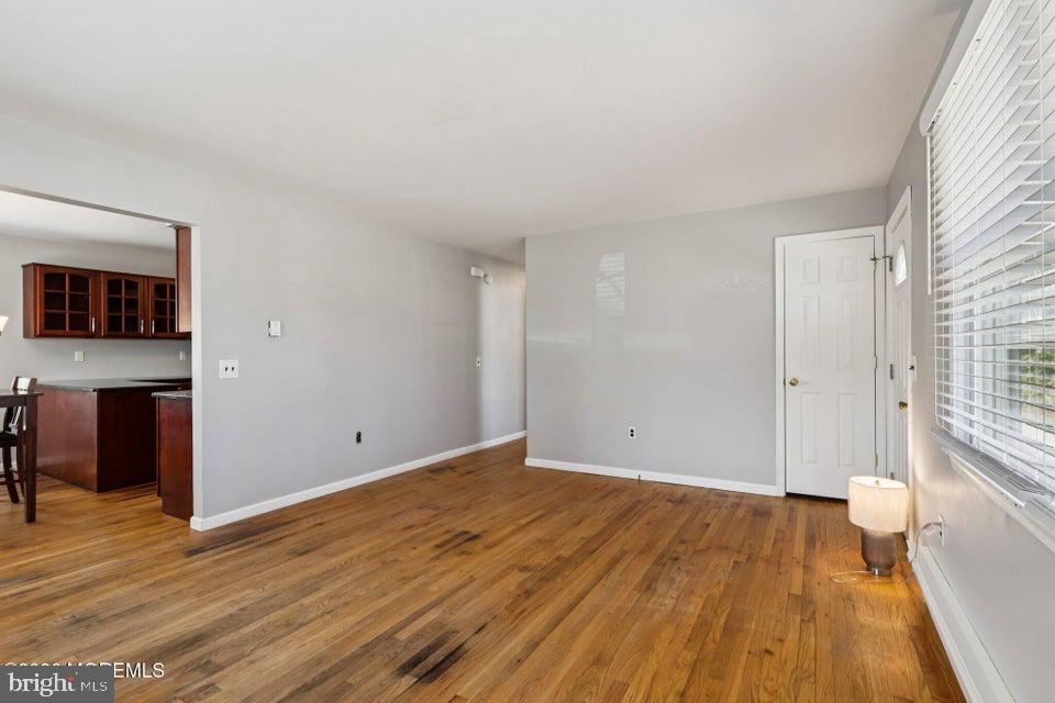 229 Point Pleasant Avenue Bayville, NJ 08721 - Photo 4 of 27 wooden floor in an empty room with a window