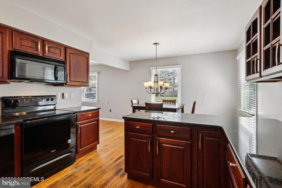 229 Point Pleasant Avenue Bayville, NJ 08721 - Photo 8 of 27 a kitchen with stainless steel appliances granite countertop a stove a sink and a microwave