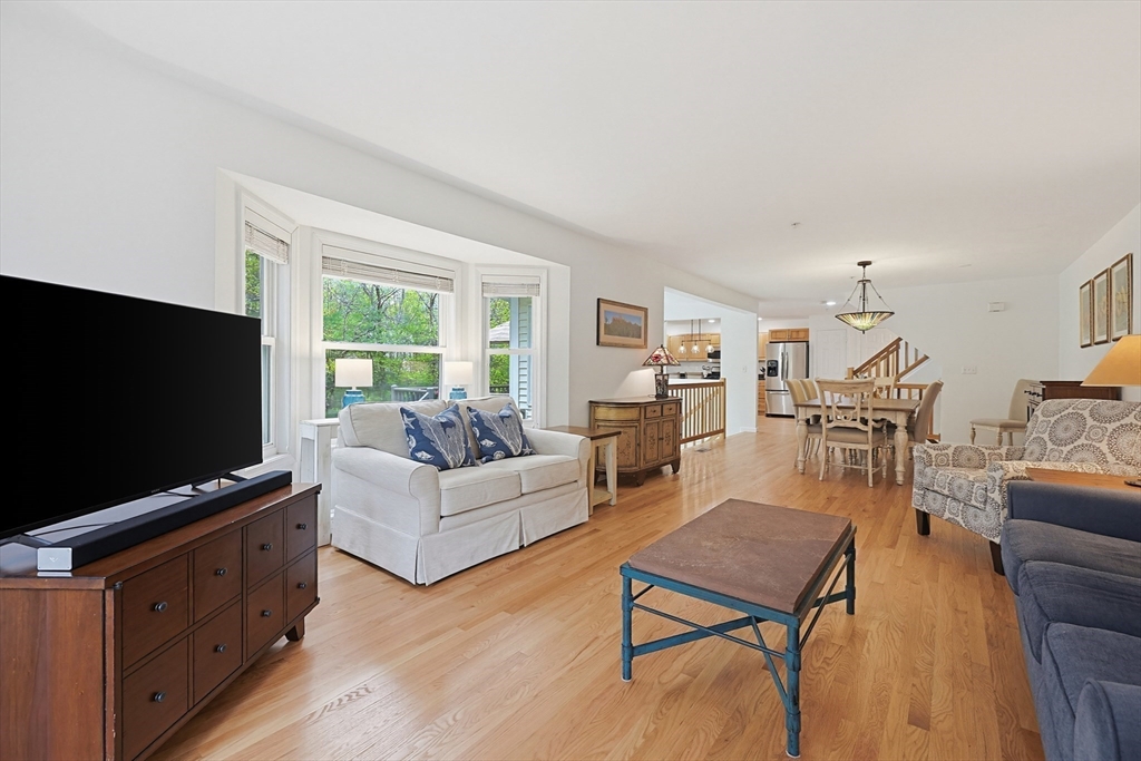 3002 Maple Brook Road, Unit 3002 Bellingham, MA 02019 - Photo 12 of 42 a living room with furniture and a flat screen tv
