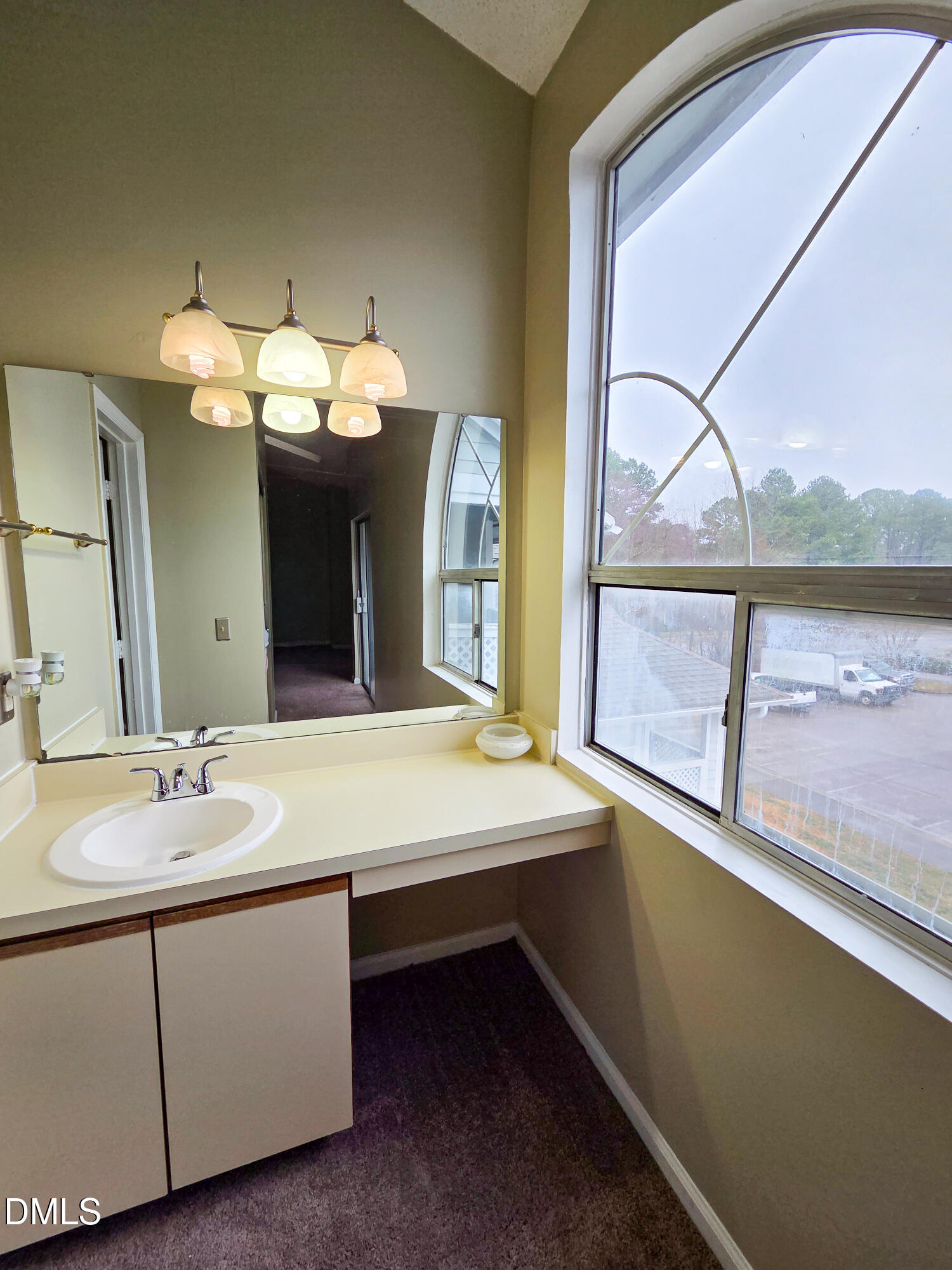 3810 Grey Harbor Drive, Unit 307 Raleigh, NC 27616 - Photo 17 of 25 a room with a chandelier furniture and a large window