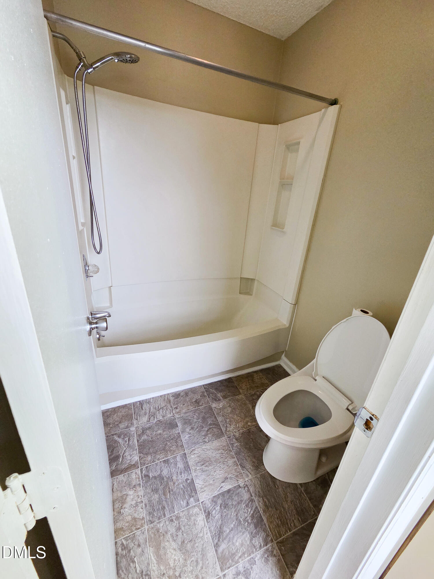3810 Grey Harbor Drive, Unit 307 Raleigh, NC 27616 - Photo 18 of 25 a bathroom with a granite countertop bathtub sink and toilet