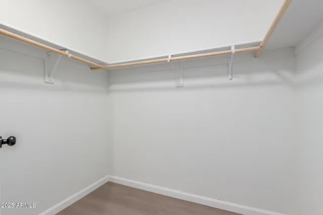 a view of an empty walk in closet