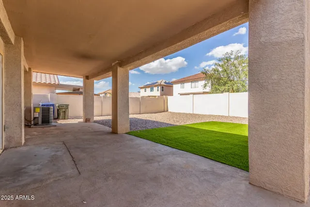 a view of a porch and garden