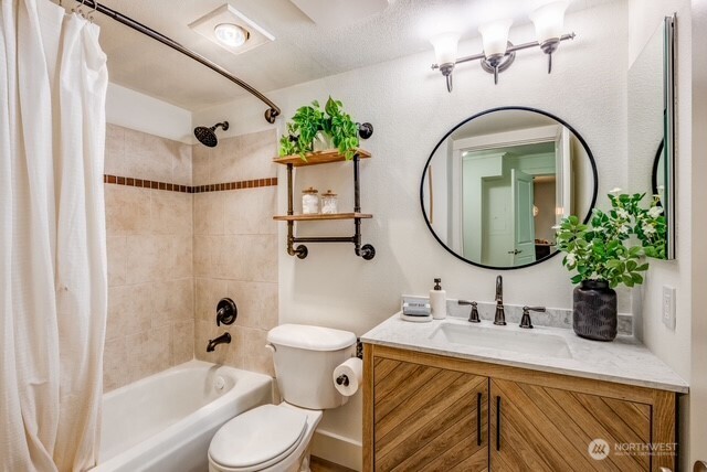 626 4th Avenue West, Unit 104 Seattle, WA 98119 - Photo 14 of 37 a bathroom with a sink a toilet and a mirror