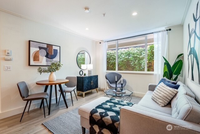626 4th Avenue West, Unit 104 Seattle, WA 98119 - Photo 5 of 37 a living room with furniture and a large window