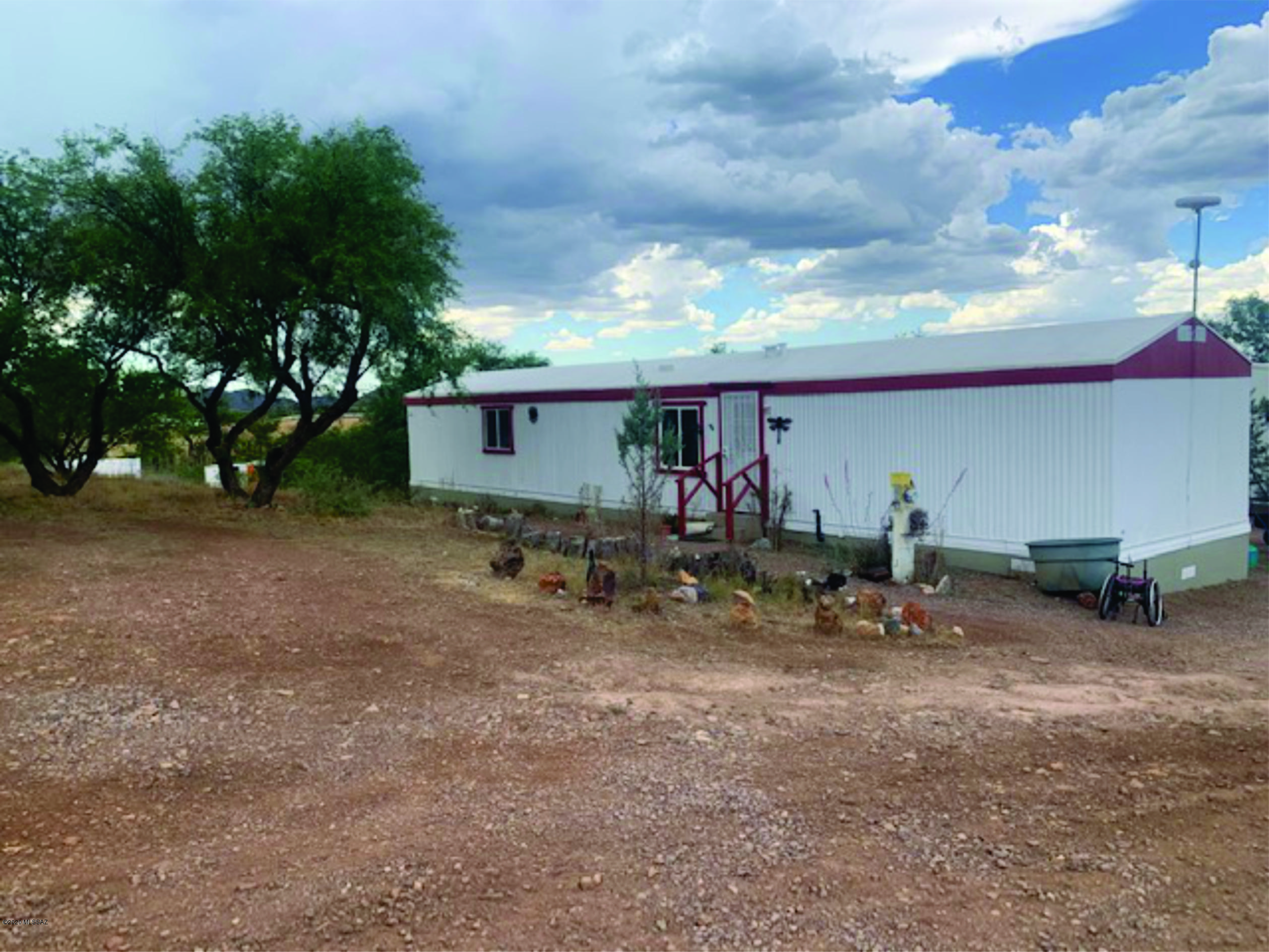 15580 West Hardscrabble Road Arivaca, AZ 85601 - Photo 10 of 14 a view of a garage with a table and chairs