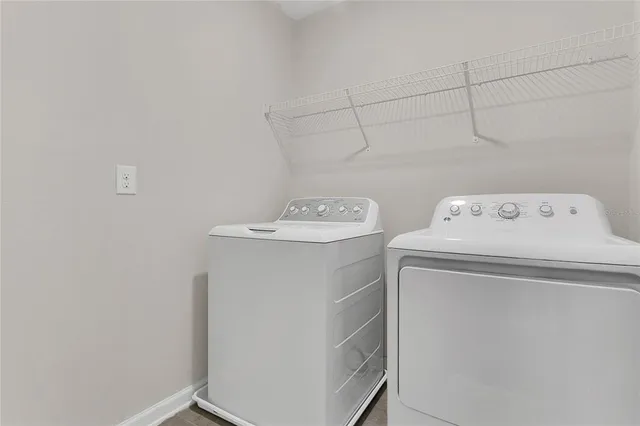 a utility room with dryer and washer