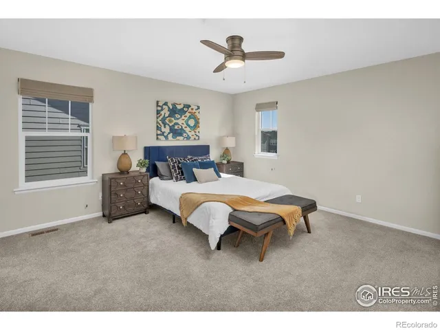 a bed room with a bed and a window