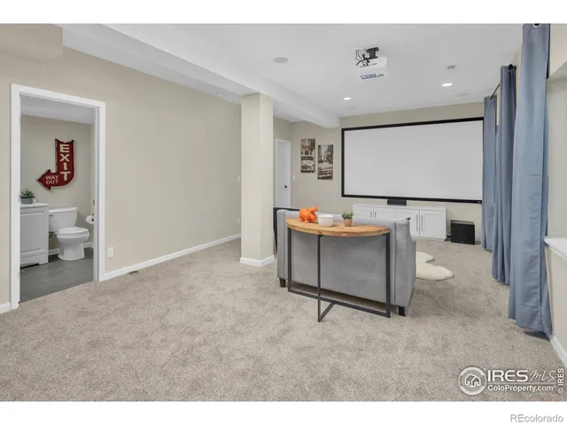 a view of a room with table and chairs