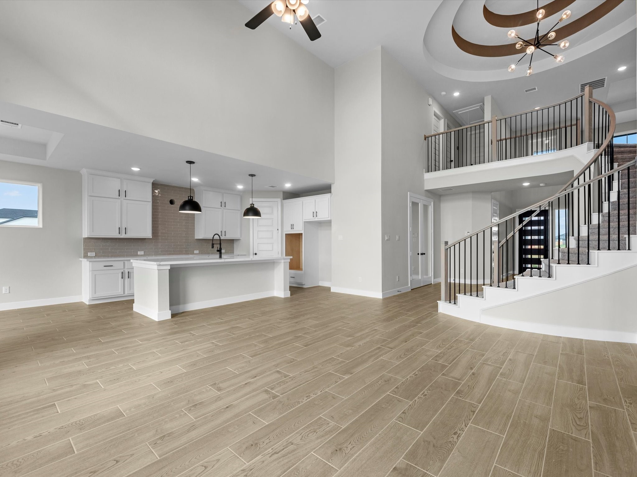 5023 McKinney Rdg Trail Rosenberg, TX 77471 - Photo 4 of 27 a view of a kitchen with kitchen island wooden floor and stainless steel appliances