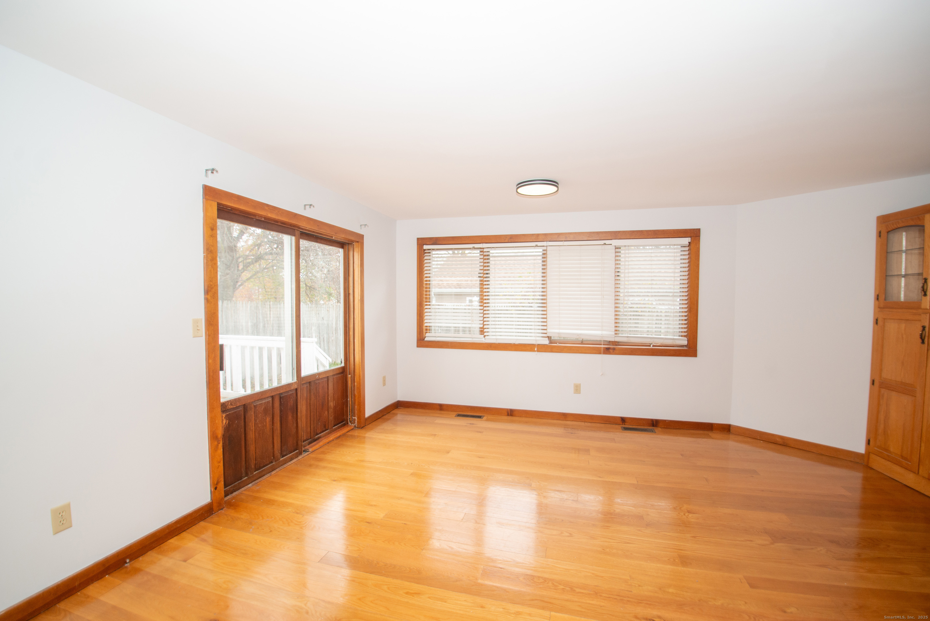 38 Wayland Road Milford, CT 06460 - Photo 12 of 39 an empty room with wooden floor and windows