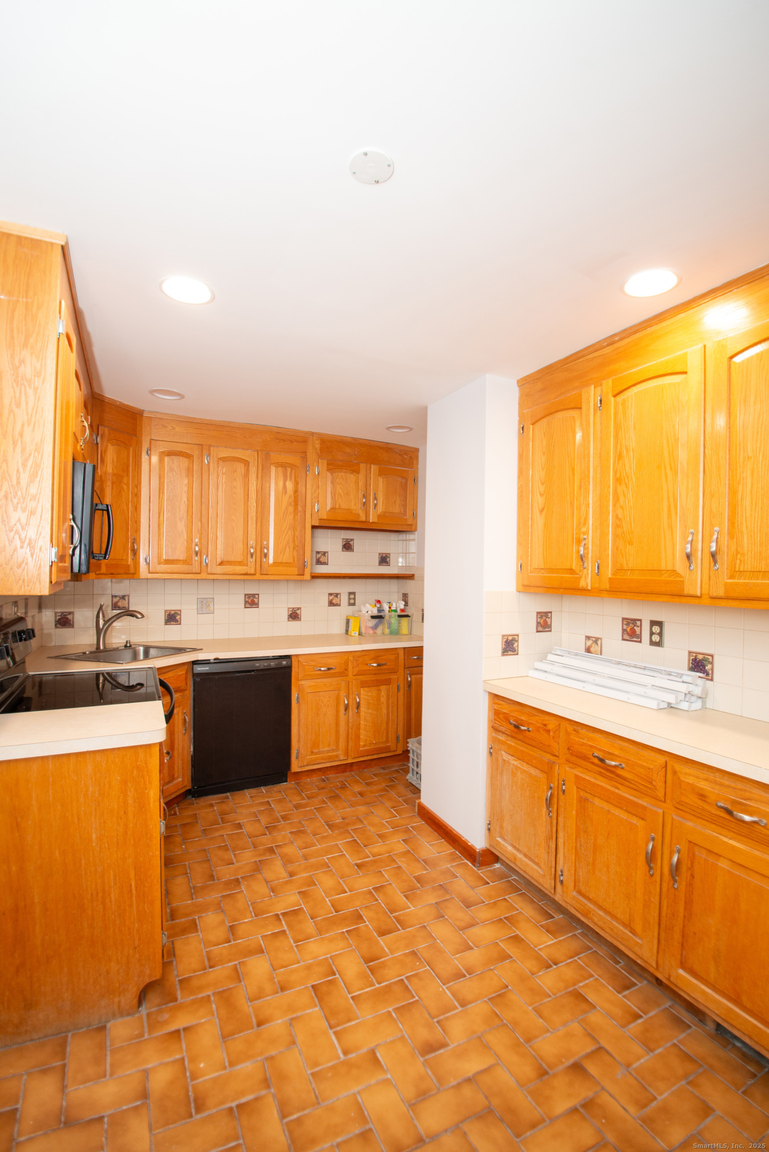 38 Wayland Road Milford, CT 06460 - Photo 17 of 39 a large kitchen with a sink and cabinets