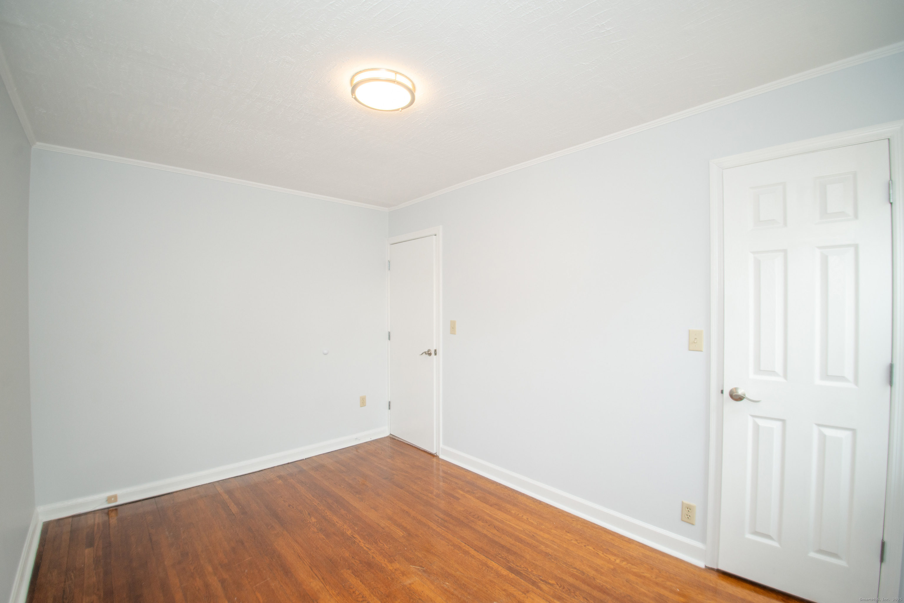 38 Wayland Road Milford, CT 06460 - Photo 27 of 39 an empty room with wooden floor