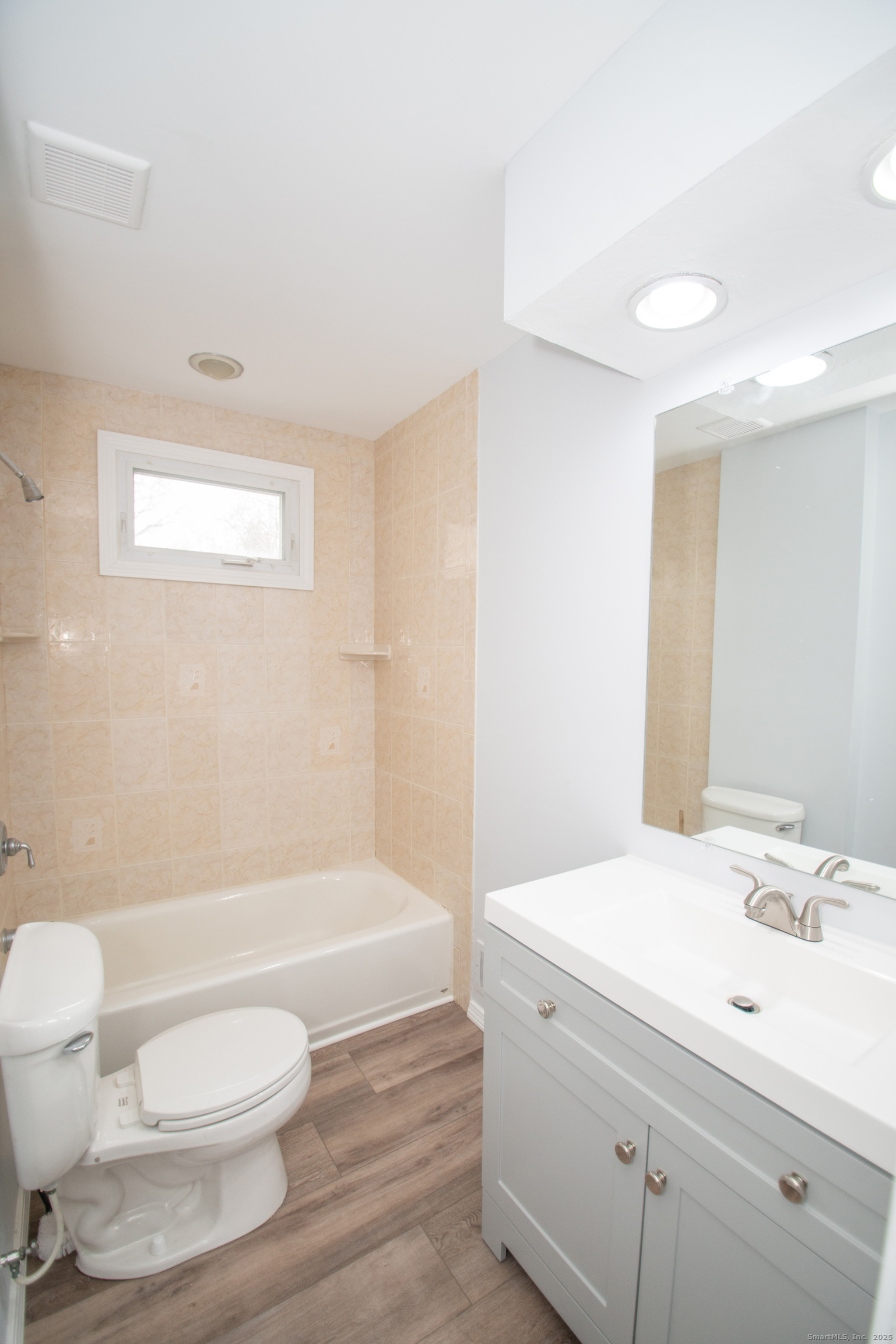 38 Wayland Road Milford, CT 06460 - Photo 32 of 39 a bathroom with a sink a toilet and a bathtub