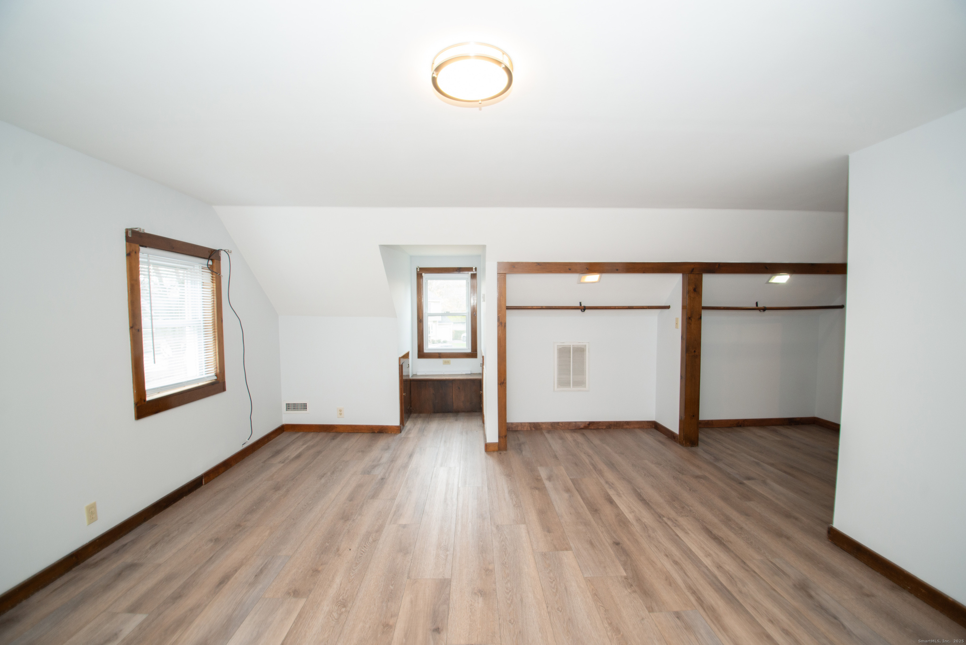 38 Wayland Road Milford, CT 06460 - Photo 37 of 39 an empty room with wooden floor and windows