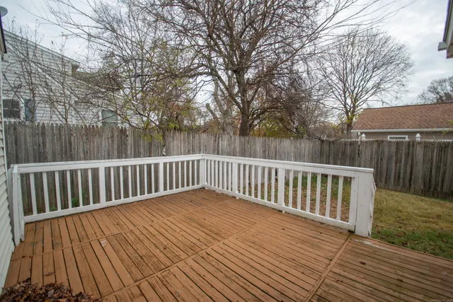 a view of deck with wooden floor and fence