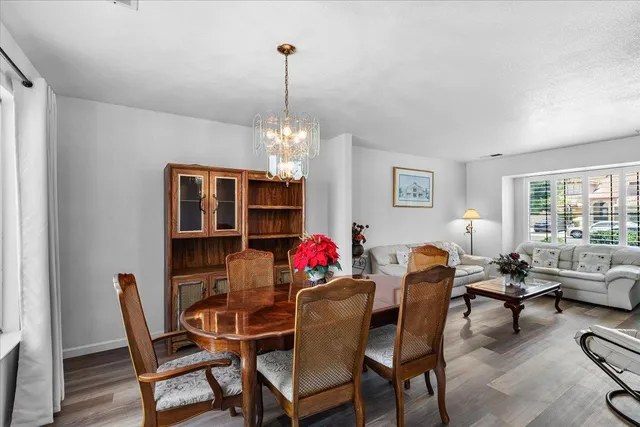 a large kitchen with a stove and a view of living room