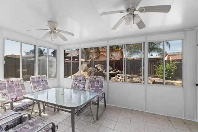 a view of a house with swimming pool and sitting area