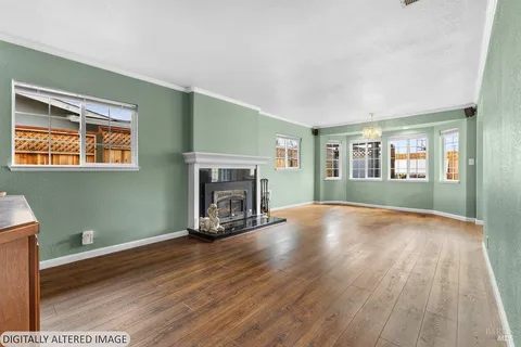 a kitchen with a refrigerator and a stove top oven