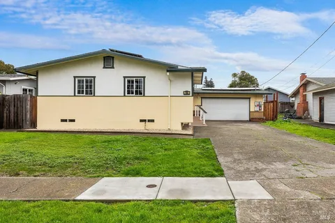 a house view with a garden space