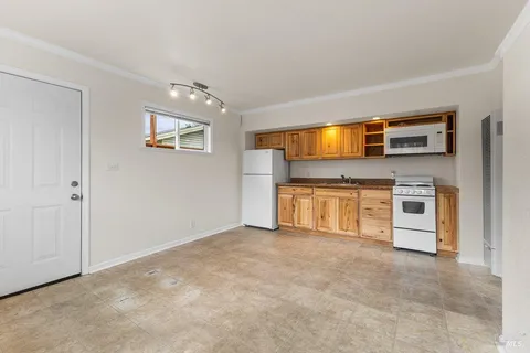 a view of room with wooden floor