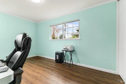 a view of a backyard with wooden fence