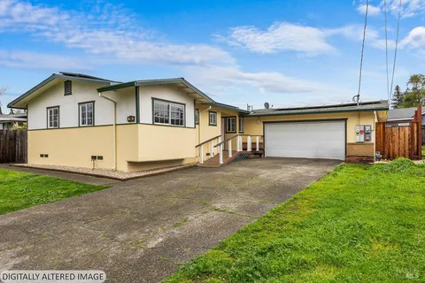 a kitchen with cabinets stainless steel appliances and a counter space
