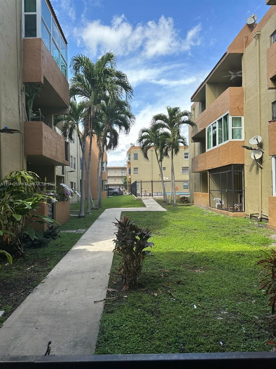 a view of a yard in front of a building