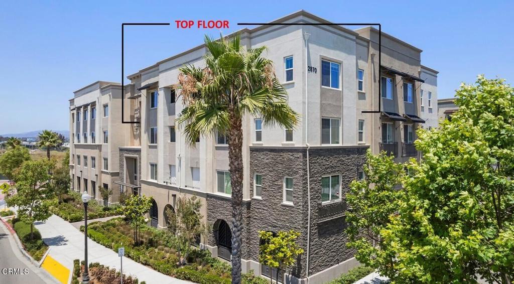 2870 Wagon Wheel Road, Unit 401 Oxnard, CA 93036 - Photo 1 of 49 a front view of a multi story residential apartment building