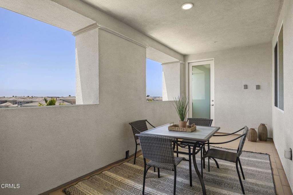 2870 Wagon Wheel Road, Unit 401 Oxnard, CA 93036 - Photo 20 of 49 a view of a dining room with furniture and wooden floor